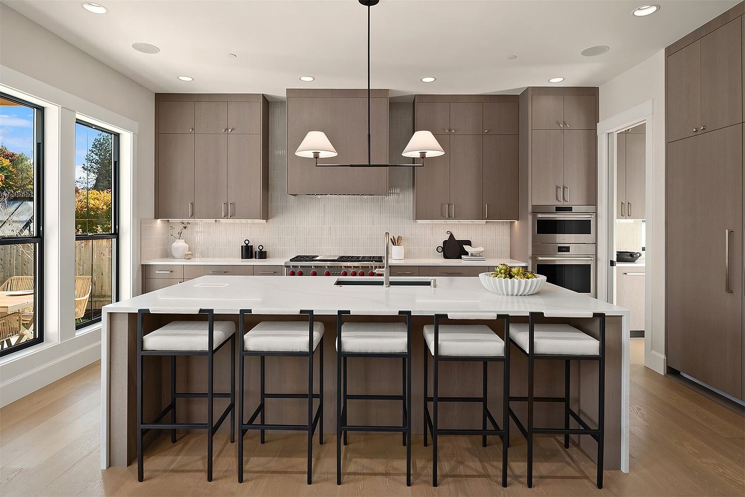 The Newport by Mirikeen Homes, the kitchen, and the kitchen behind it