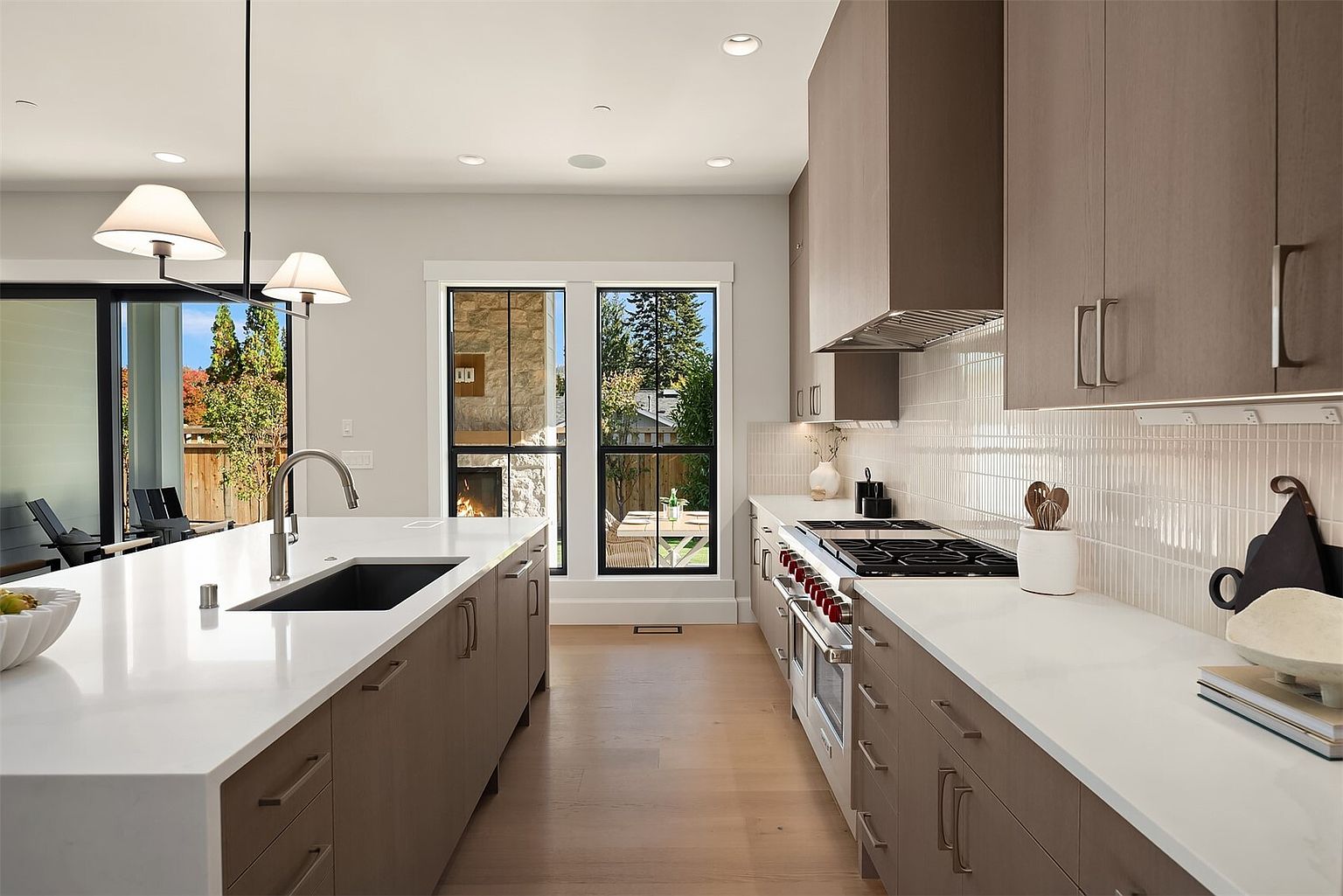 The Newport by Mirikeen Homes, the kitchen, and the kitchen behind it
