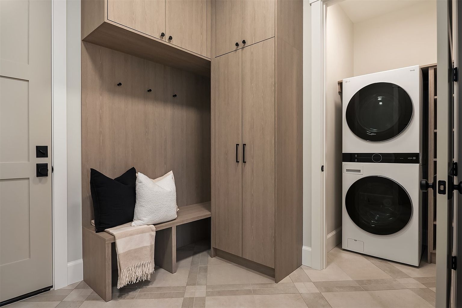 The Newport by Mirikeen Homes, the main-floor suite, the mudroom and the yard