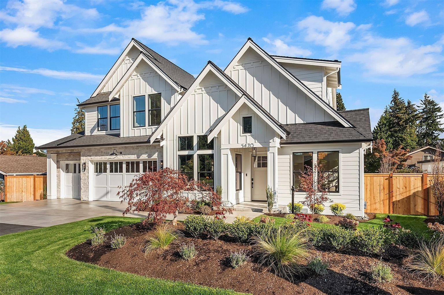 The Newport by Mirikeen Homes, the main-floor suite, the mudroom and the yard